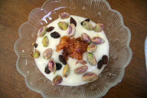 Plain yogurt, with Grandma Hoerner's Orange Marmalade, pistachios, and raisins.