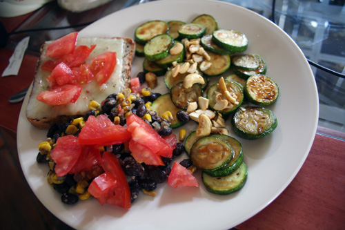 Topped with pepper jack - accompanied by zucchini with sweet-n-sour cashews, and black beans and corn with chunks of Hanover tomatoes.