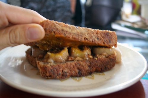 A breakfast sandwich with bananas, peanut butter, and pumpkin butter.