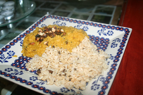 Pumpkin & lentil curry garnished with toasted almonds and served with cinnamon brown rice.