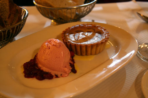 A sweet potato tart with cranberry ice cream and a ginger creme anglaise.